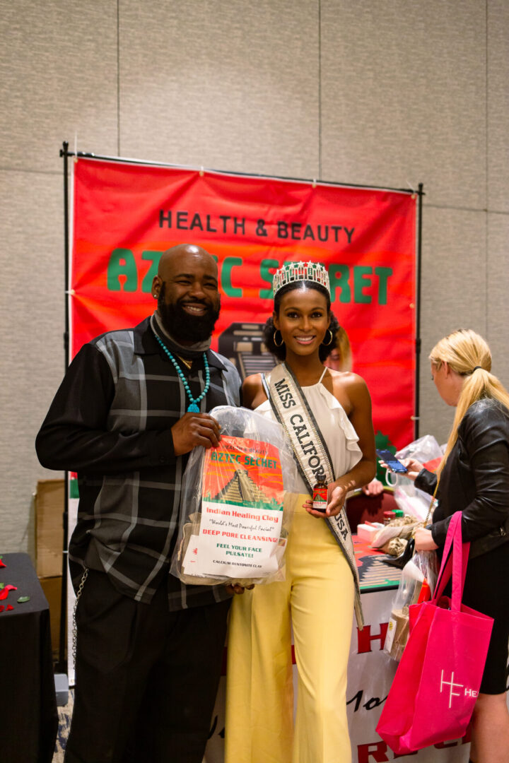 A man posing with Miss California | Aztec Secret Health & Beauty LTD