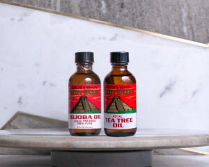 Two Pack combo of aztec secret Royal Tea Tree and Jojoba two ounce essential oils